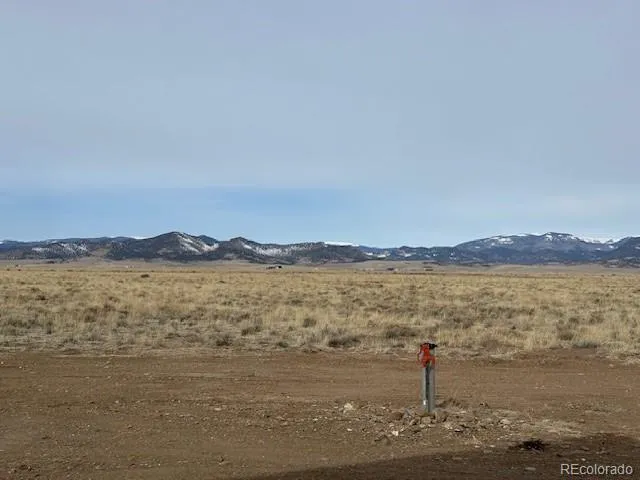 a view of an ocean beach and mountain