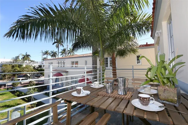 a backyard of a house with seating space and trees