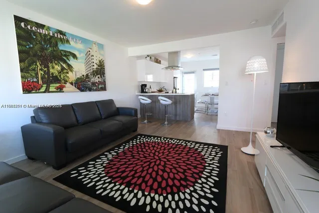 a living room with couch and a flat screen tv