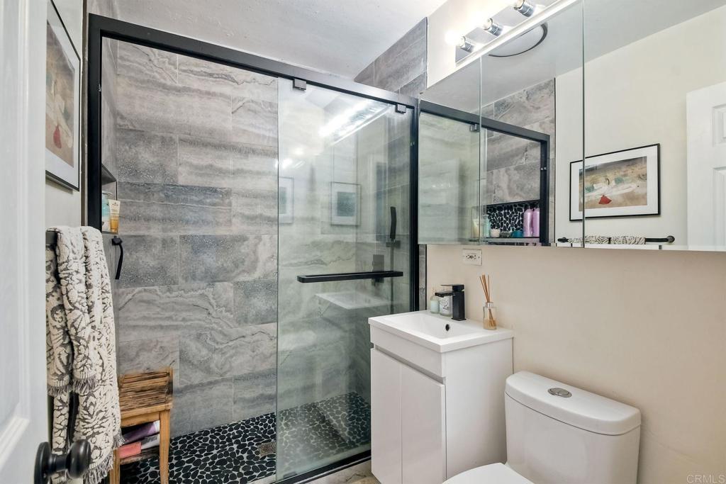 476 La Veta Avenue Encinitas, CA 92024 - Photo 12 of 24 a bathroom with a toilet a sink and shower