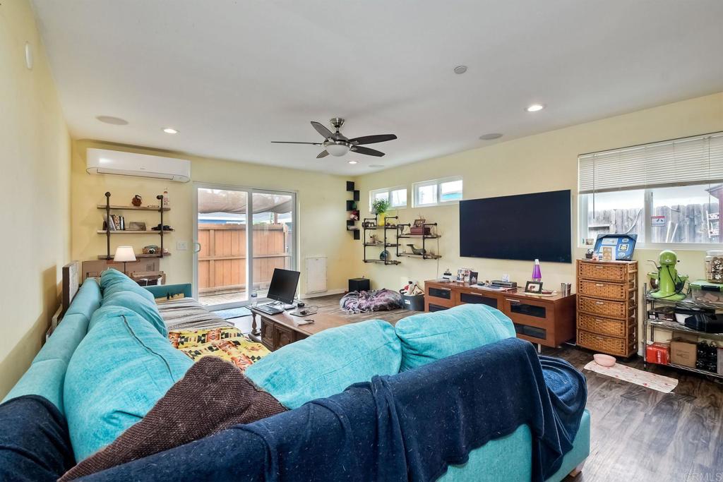 476 La Veta Avenue Encinitas, CA 92024 - Photo 16 of 24 a living room with furniture kitchen view and a large window