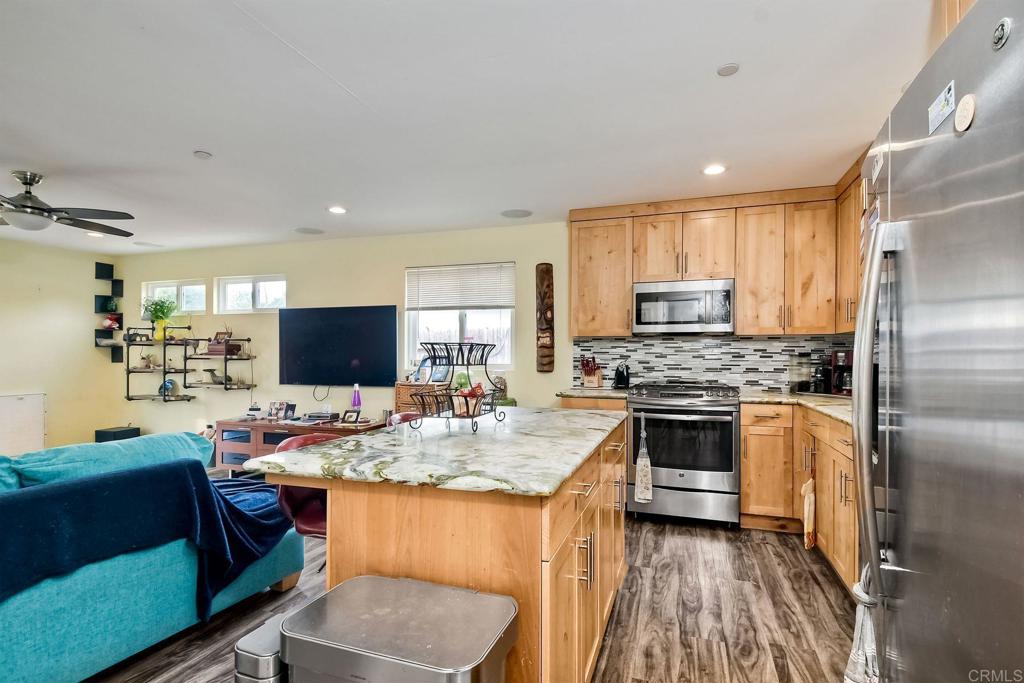 476 La Veta Avenue Encinitas, CA 92024 - Photo 17 of 24 a kitchen with a refrigerator stove top oven and sink