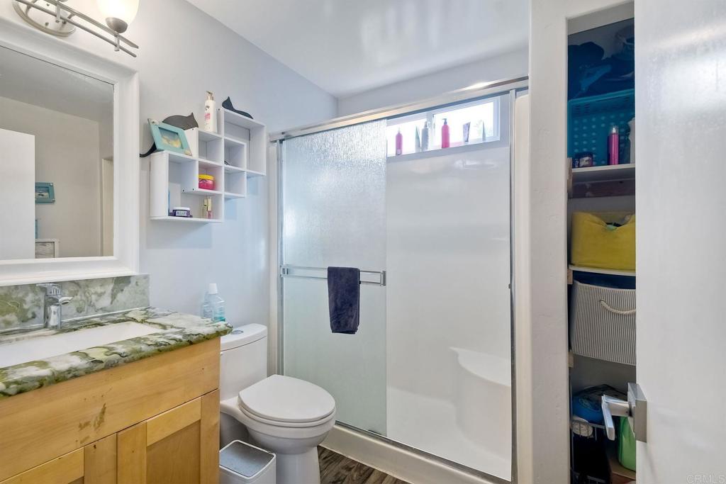 476 La Veta Avenue Encinitas, CA 92024 - Photo 19 of 24 a bathroom with a granite countertop sink toilet and shower