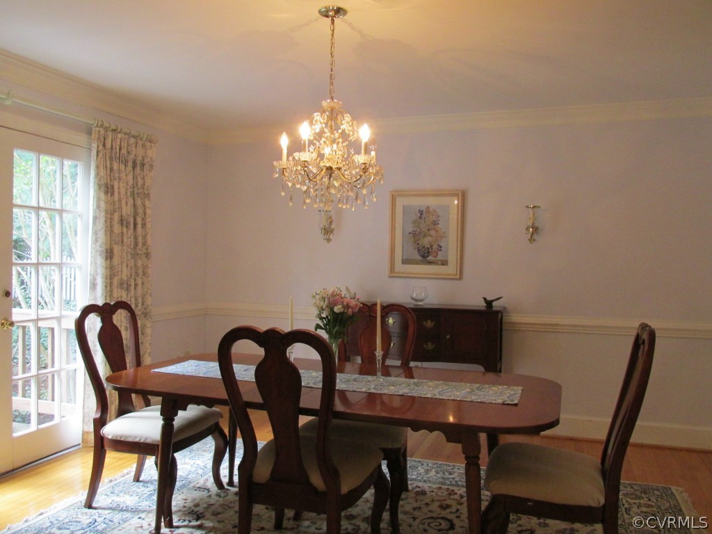 2230 Corner Rock Road Midlothian, VA 23113 - Photo 4 of 24 a view of a dining room with furniture and chandelier