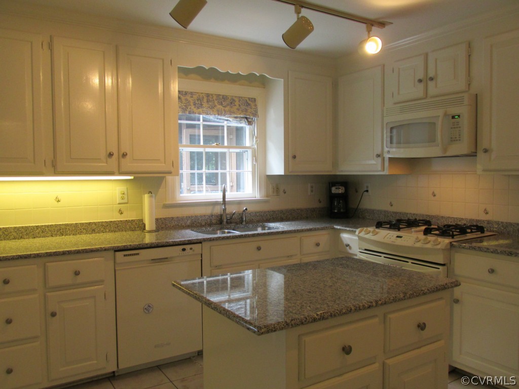 2230 Corner Rock Road Midlothian, VA 23113 - Photo 6 of 24 a kitchen with sink cabinets and window