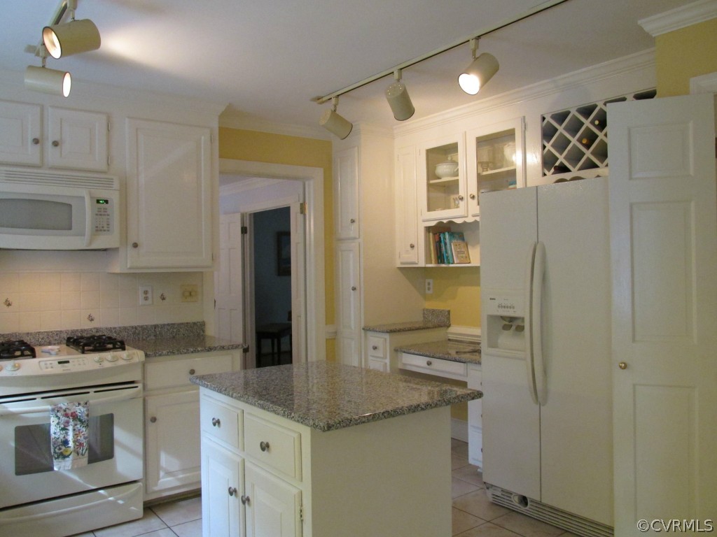 2230 Corner Rock Road Midlothian, VA 23113 - Photo 7 of 24 a kitchen with stainless steel appliances granite countertop a sink and cabinets