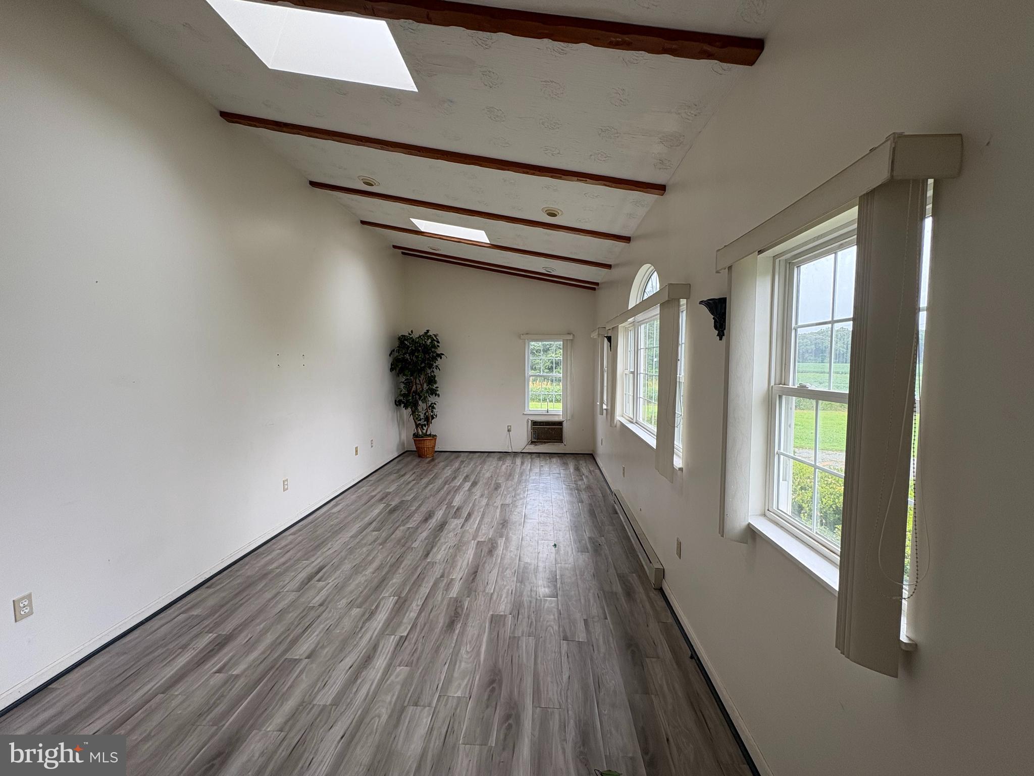 6525 Nomini Hall Road Hague, VA 22469 - Photo 11 of 44 a view of hallway with wooden floor and stairs