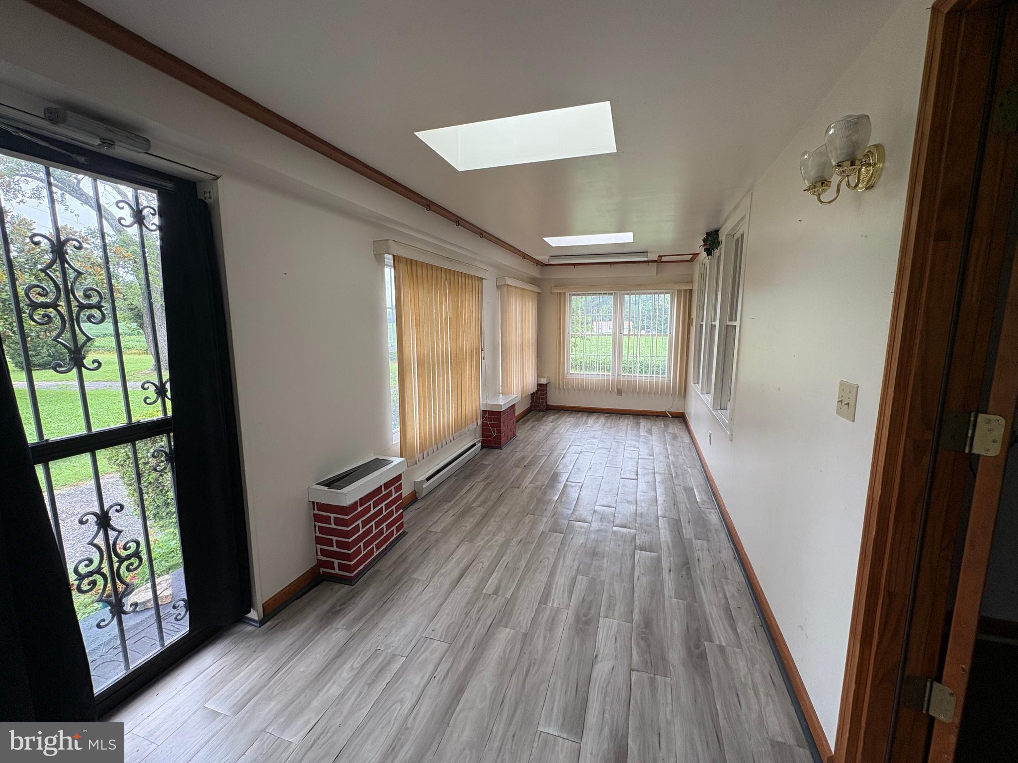 6525 Nomini Hall Road Hague, VA 22469 - Photo 12 of 44 wooden floor in an empty room with a window