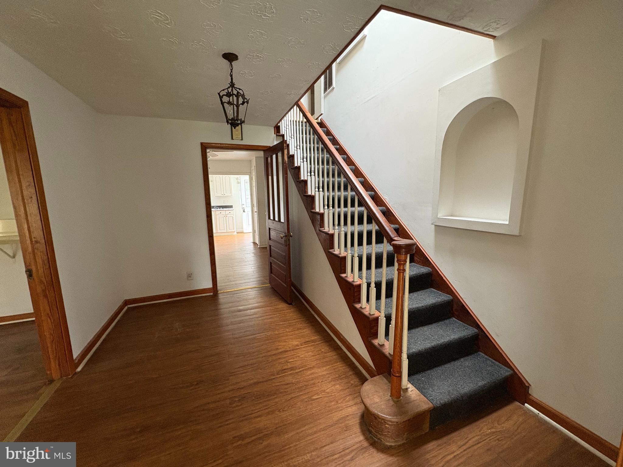 6525 Nomini Hall Road Hague, VA 22469 - Photo 17 of 44 a view of entryway and hall with wooden floor