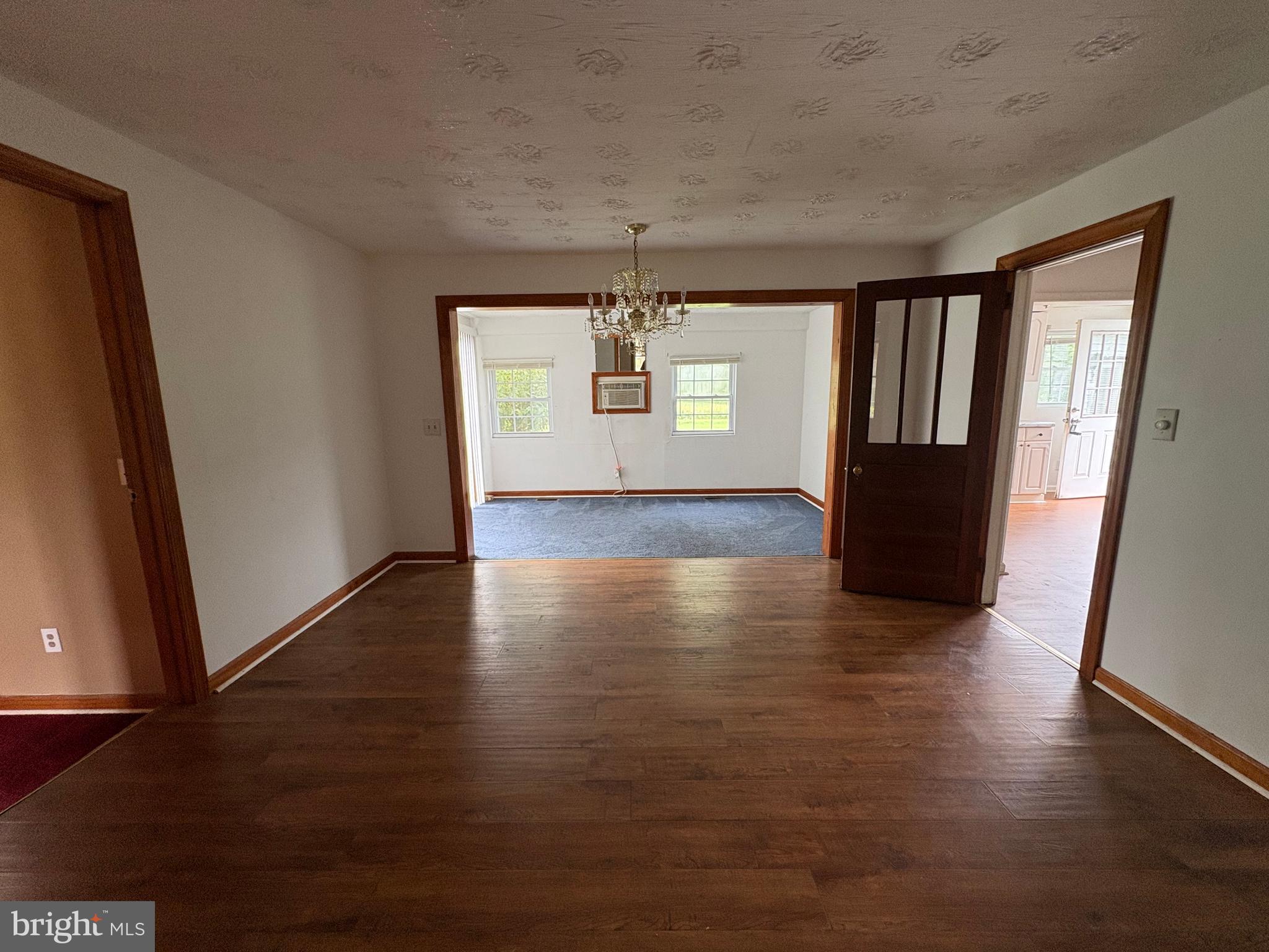6525 Nomini Hall Road Hague, VA 22469 - Photo 20 of 44 an empty room with wooden floor and windows