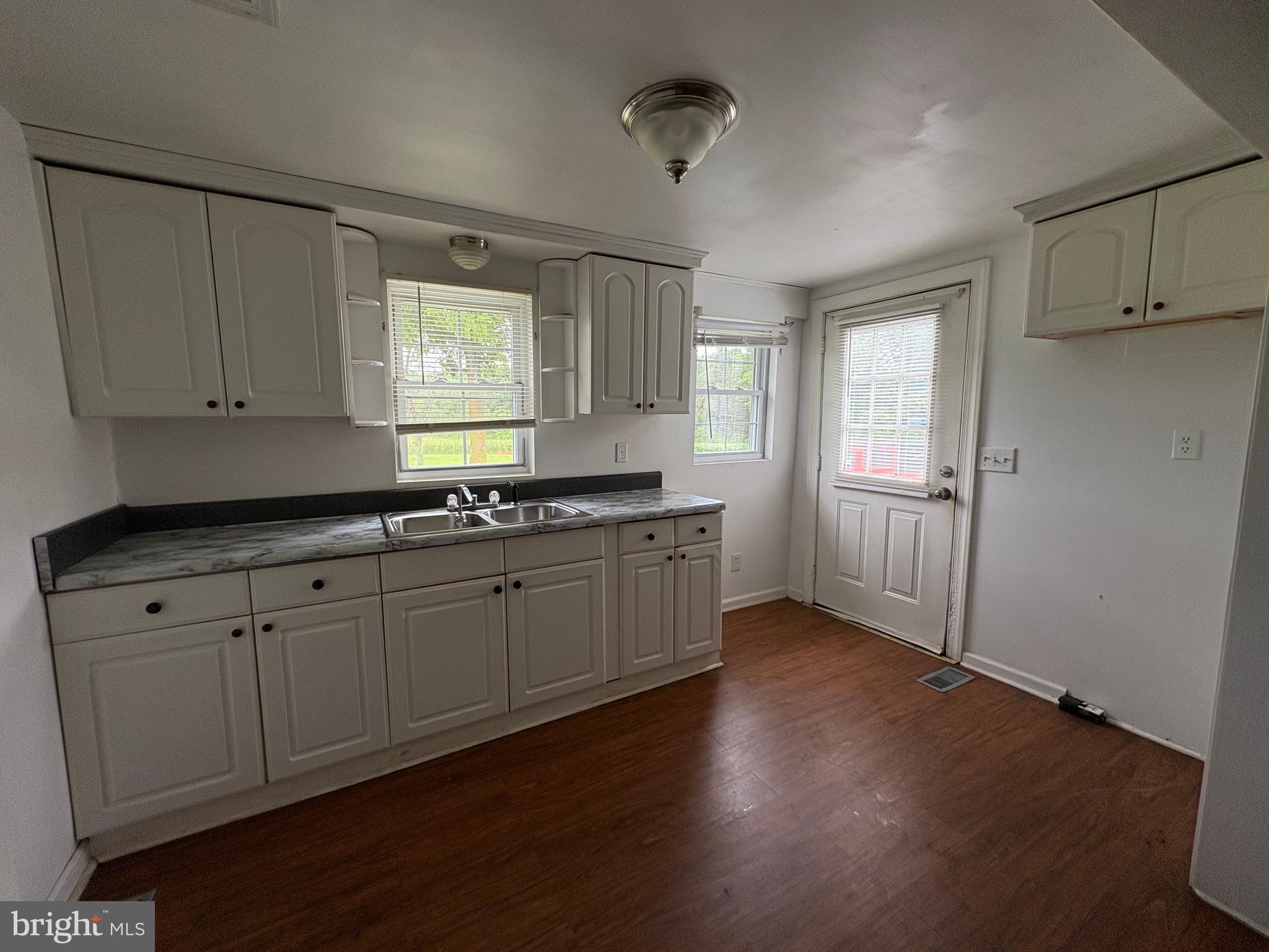 6525 Nomini Hall Road Hague, VA 22469 - Photo 23 of 44 a kitchen with sink cabinets and window