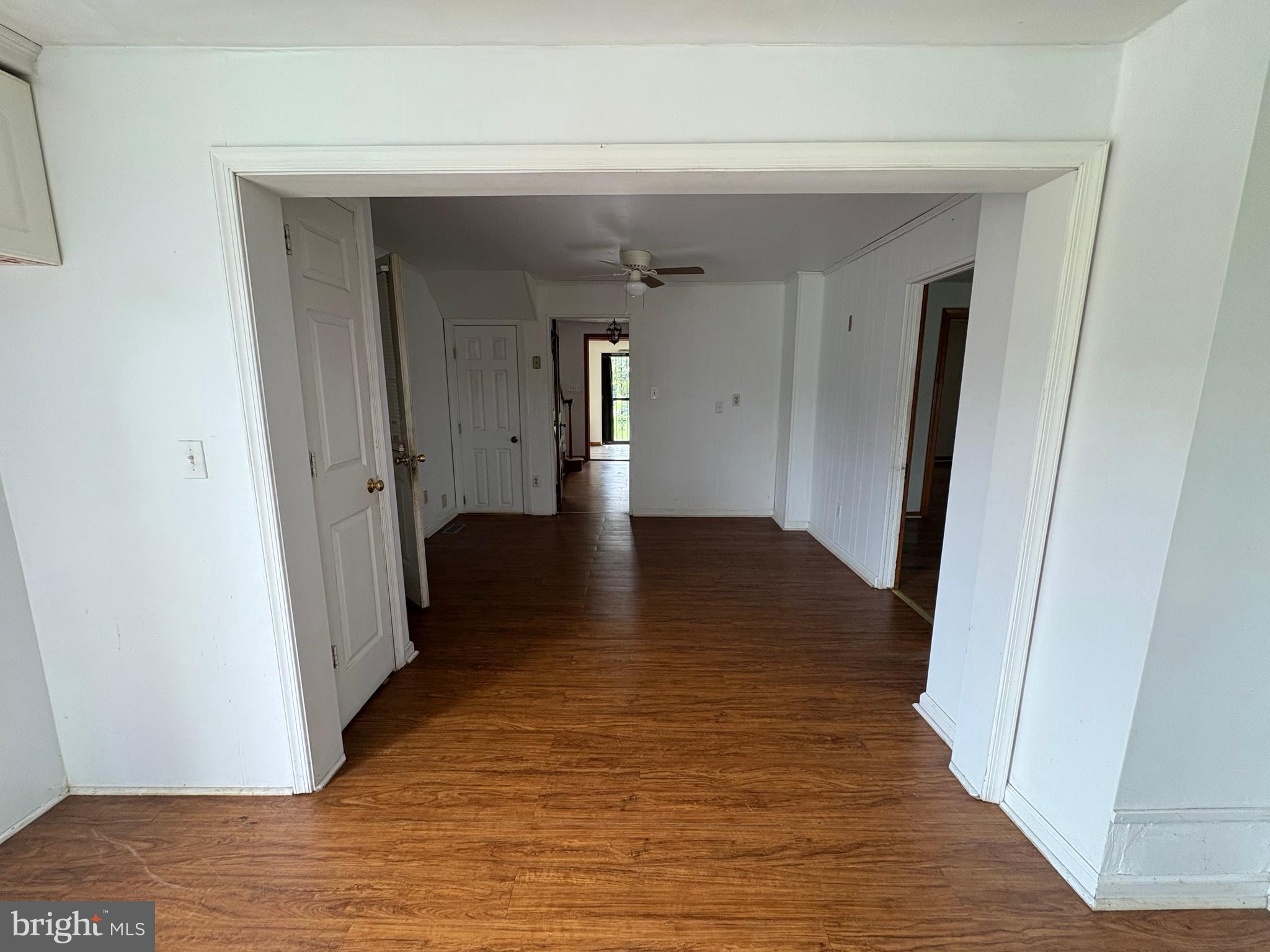 6525 Nomini Hall Road Hague, VA 22469 - Photo 24 of 44 a view of a hallway with wooden floor and closet