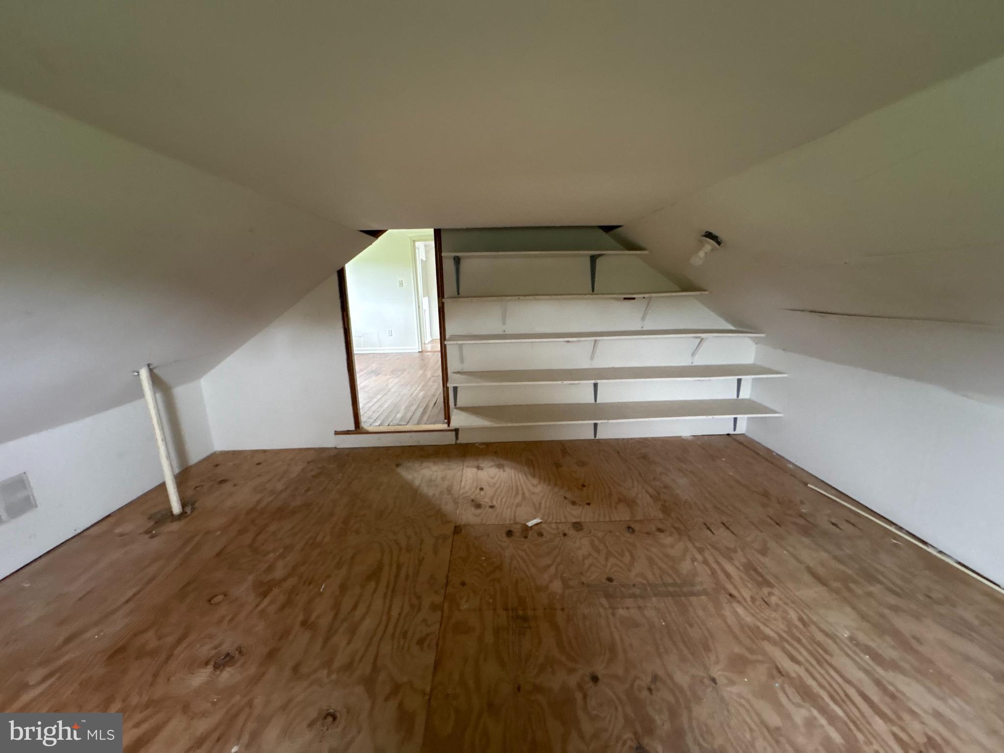 6525 Nomini Hall Road Hague, VA 22469 - Photo 27 of 44 a bedroom with a bed and chair