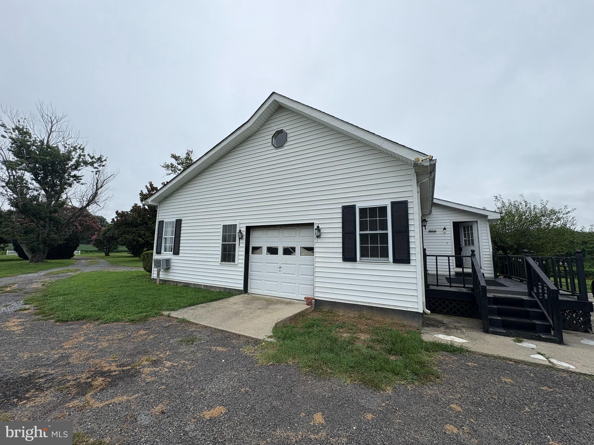6525 Nomini Hall Road Hague, VA 22469 - Photo 7 of 44 a front view of a house with a yard