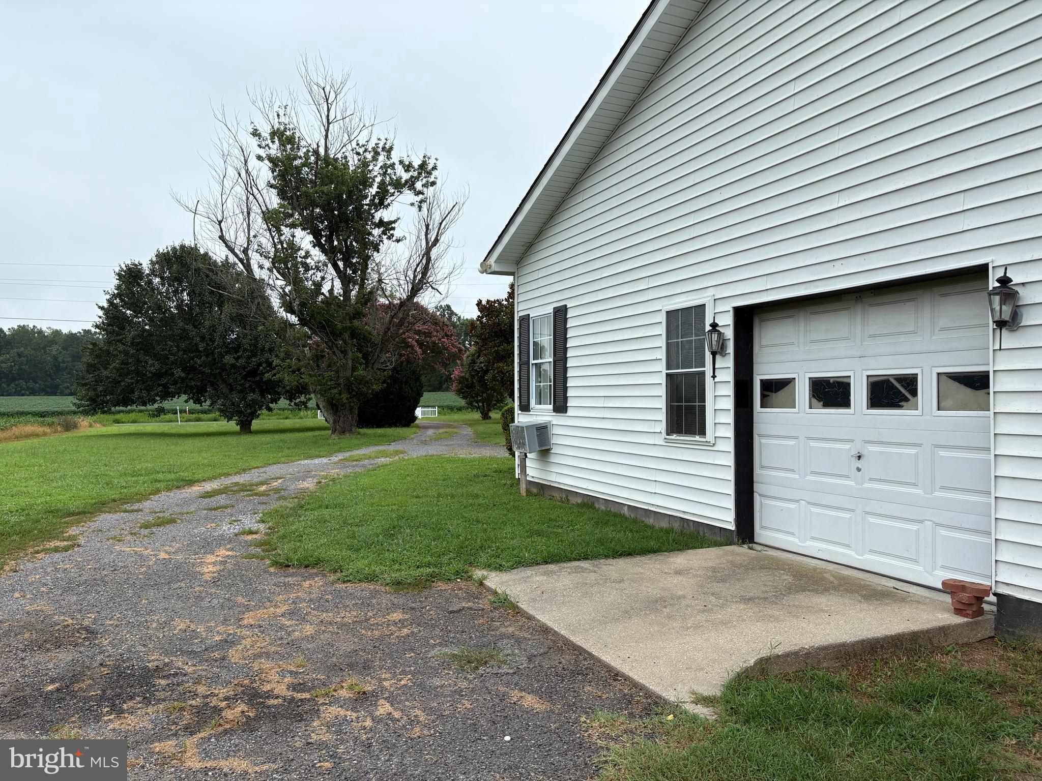 6525 Nomini Hall Road Hague, VA 22469 - Photo 8 of 44 a front view of a house with a yard