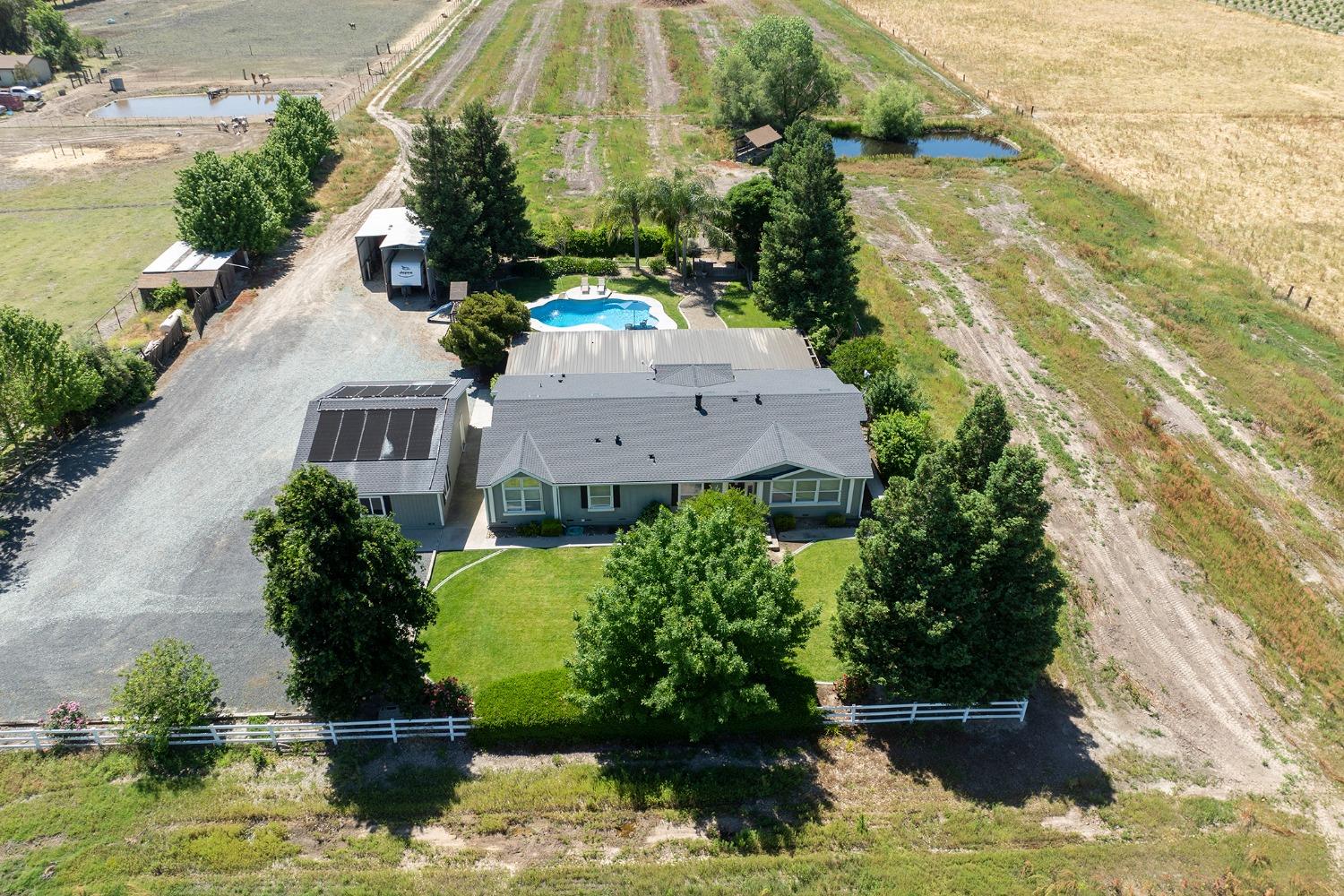 9101 Biederman Way Escalon, CA 95320 - Photo 1 of 1 a view of a lake with a yard
