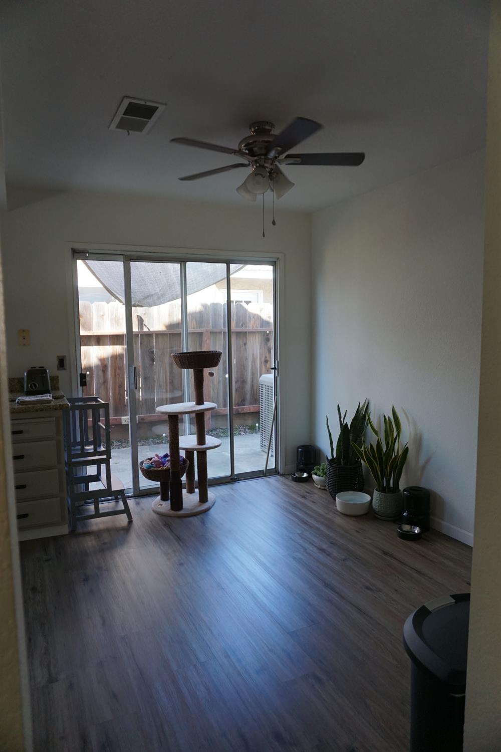 954 Wake Forest Court Merced, CA 95348 - Photo 11 of 36 a living room with furniture and a floor to ceiling window