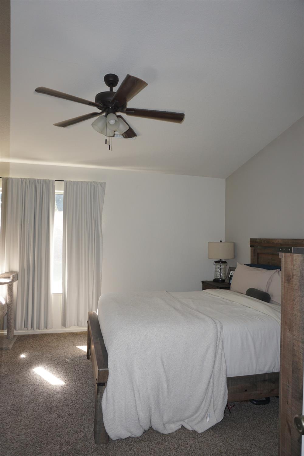 954 Wake Forest Court Merced, CA 95348 - Photo 15 of 36 a bedroom with a bed and window