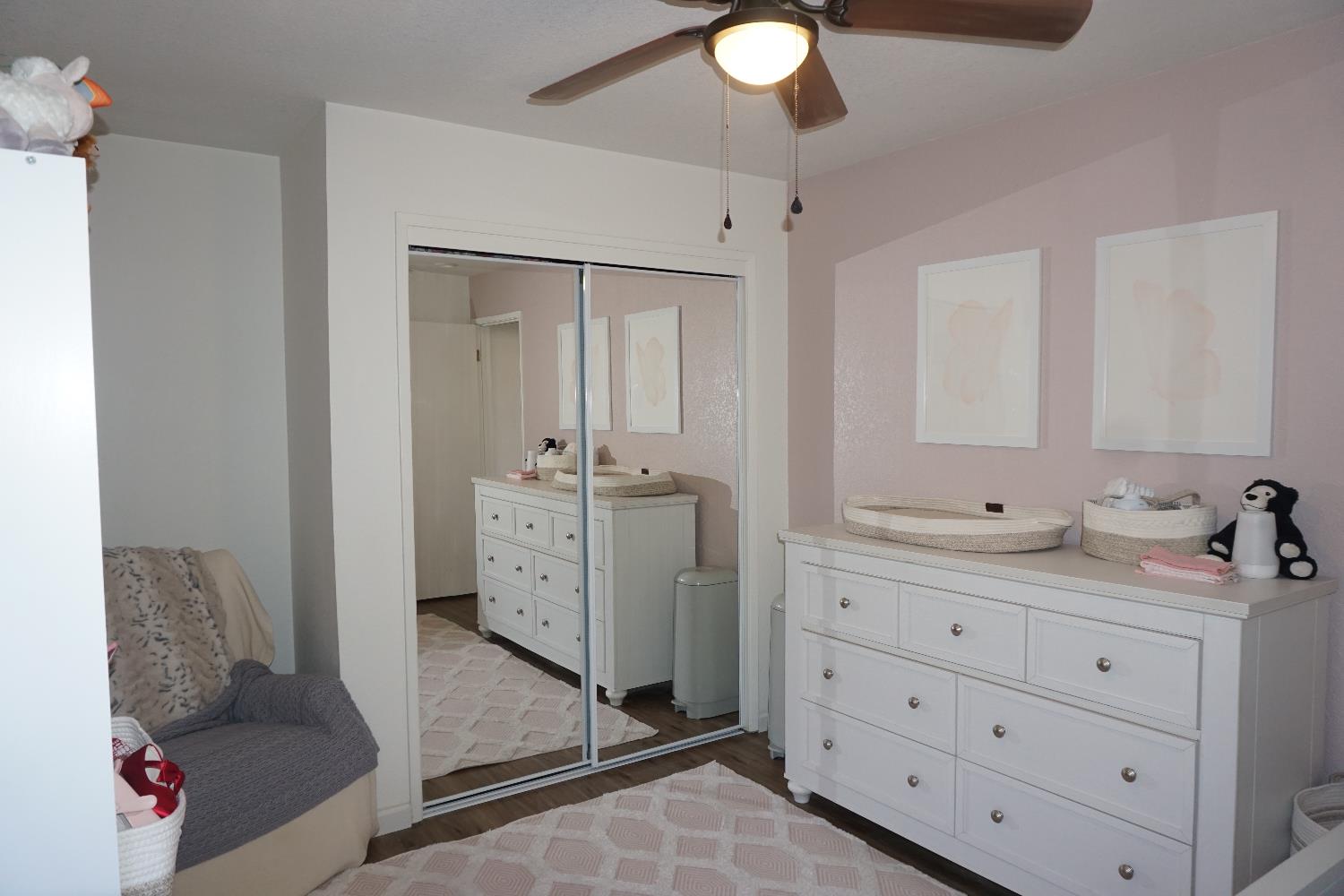 954 Wake Forest Court Merced, CA 95348 - Photo 23 of 36 a bathroom with a double vanity sink mirror and window
