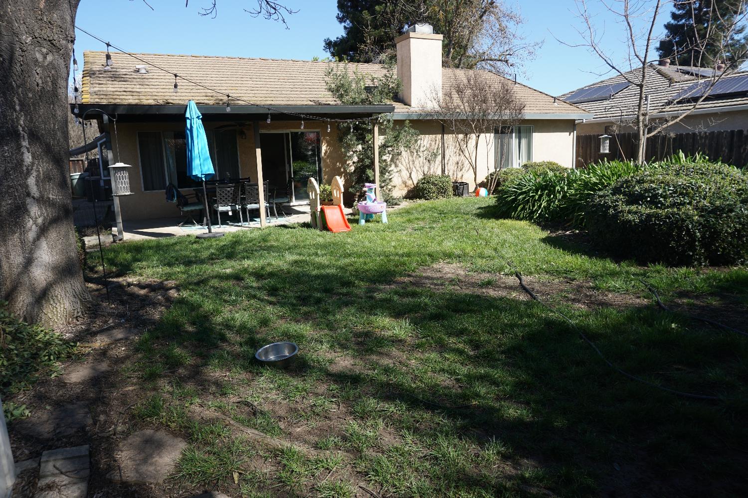 954 Wake Forest Court Merced, CA 95348 - Photo 35 of 36 a view of a building with a garden