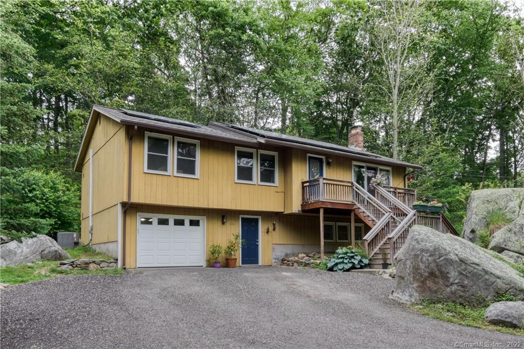 111 Airline Road Clinton, CT 06413 - Photo 1 of 1 a front view of a house with garage