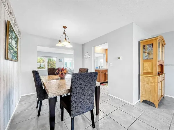a view of a dining room with furniture and window