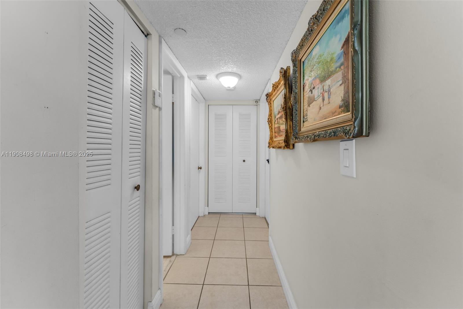 8650 Southwest 133rd Avenue Road, Unit 216 Miami, FL 33183 - Photo 11 of 36 Hallway that leads to the bathroom and bedrooms.