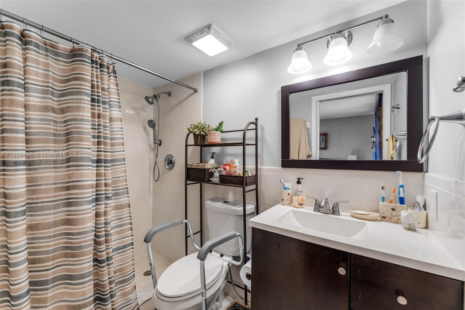8650 Southwest 133rd Avenue Road, Unit 216 Miami, FL 33183 - Photo 12 of 36 Main bedroom with an en-suite bathroom featuring a shower