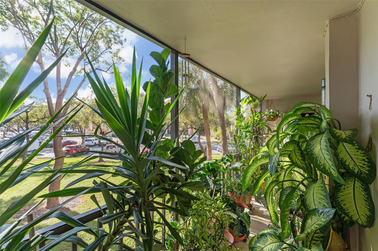 8650 Southwest 133rd Avenue Road, Unit 216 Miami, FL 33183 - Photo 20 of 36 View of the parking area and green space.