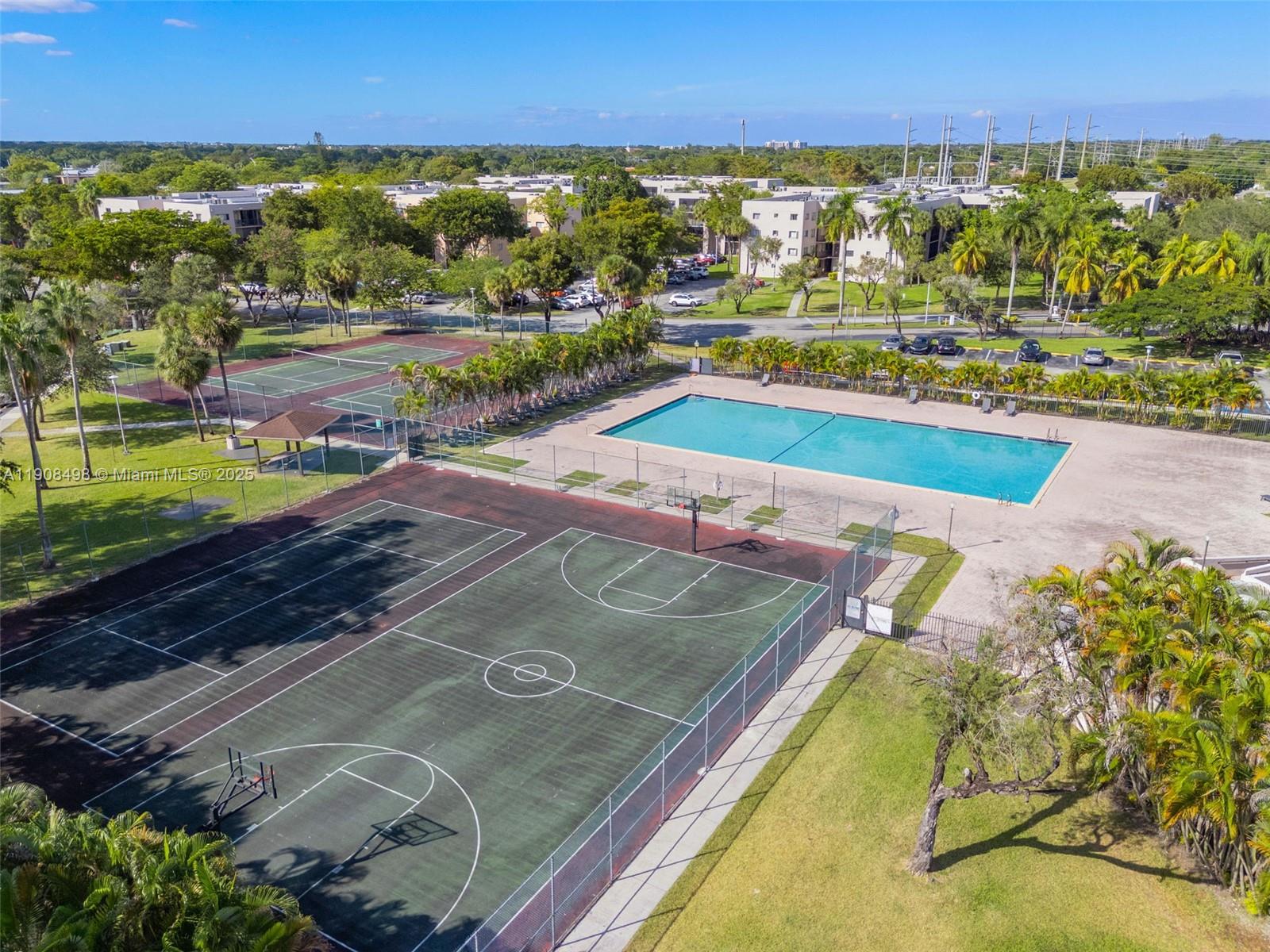 8650 Southwest 133rd Avenue Road, Unit 216 Miami, FL 33183 - Photo 22 of 36 Community pool and basketball court.