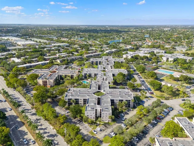an aerial view of residential building and lake