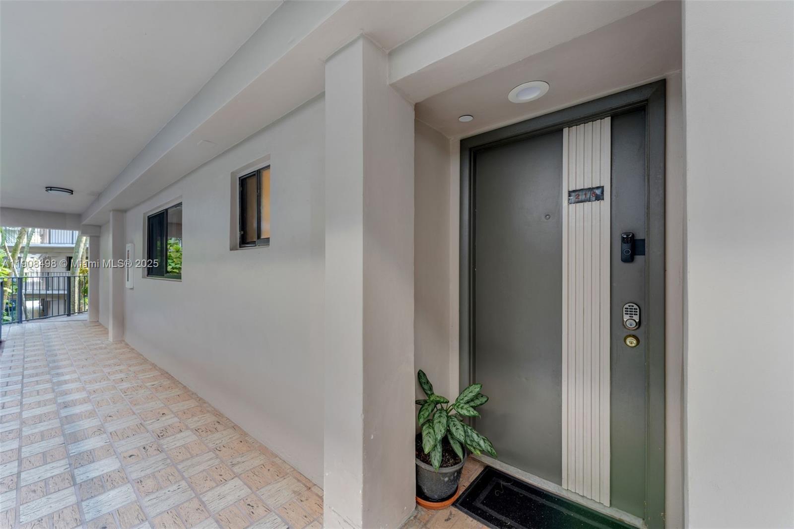 8650 Southwest 133rd Avenue Road, Unit 216 Miami, FL 33183 - Photo 3 of 36 Front door of the apartment