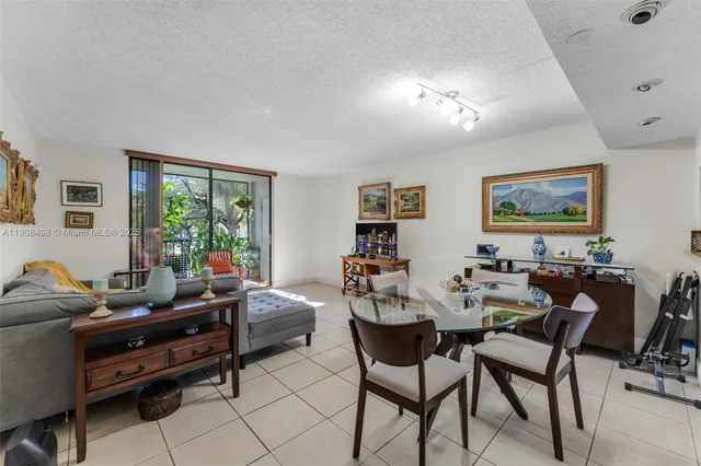 a living room with furniture a rug and a window