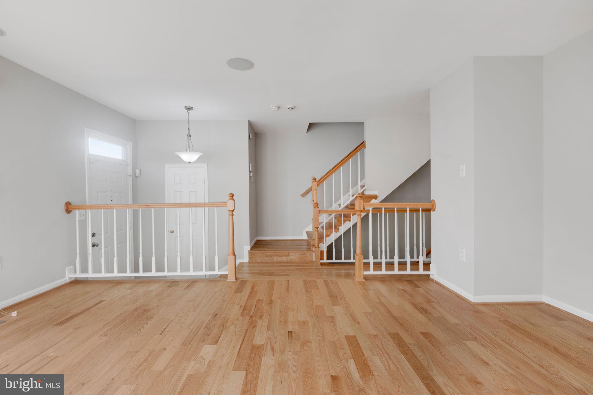 7267 Olde Lantern Way Springfield, VA 22152 - Photo 16 of 52 a view of staircase with wooden floor and a window