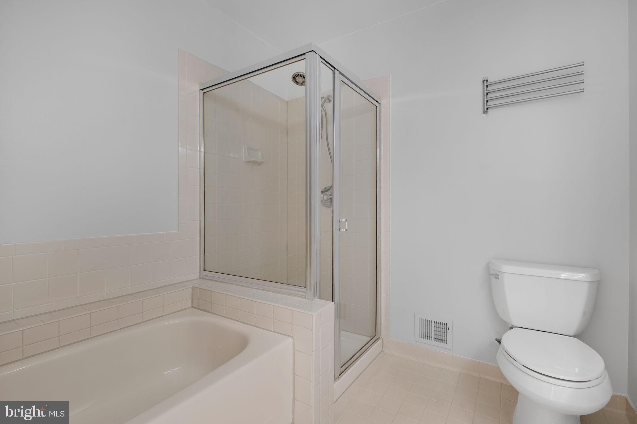 7267 Olde Lantern Way Springfield, VA 22152 - Photo 23 of 52 a bathroom with a toilet and a shower