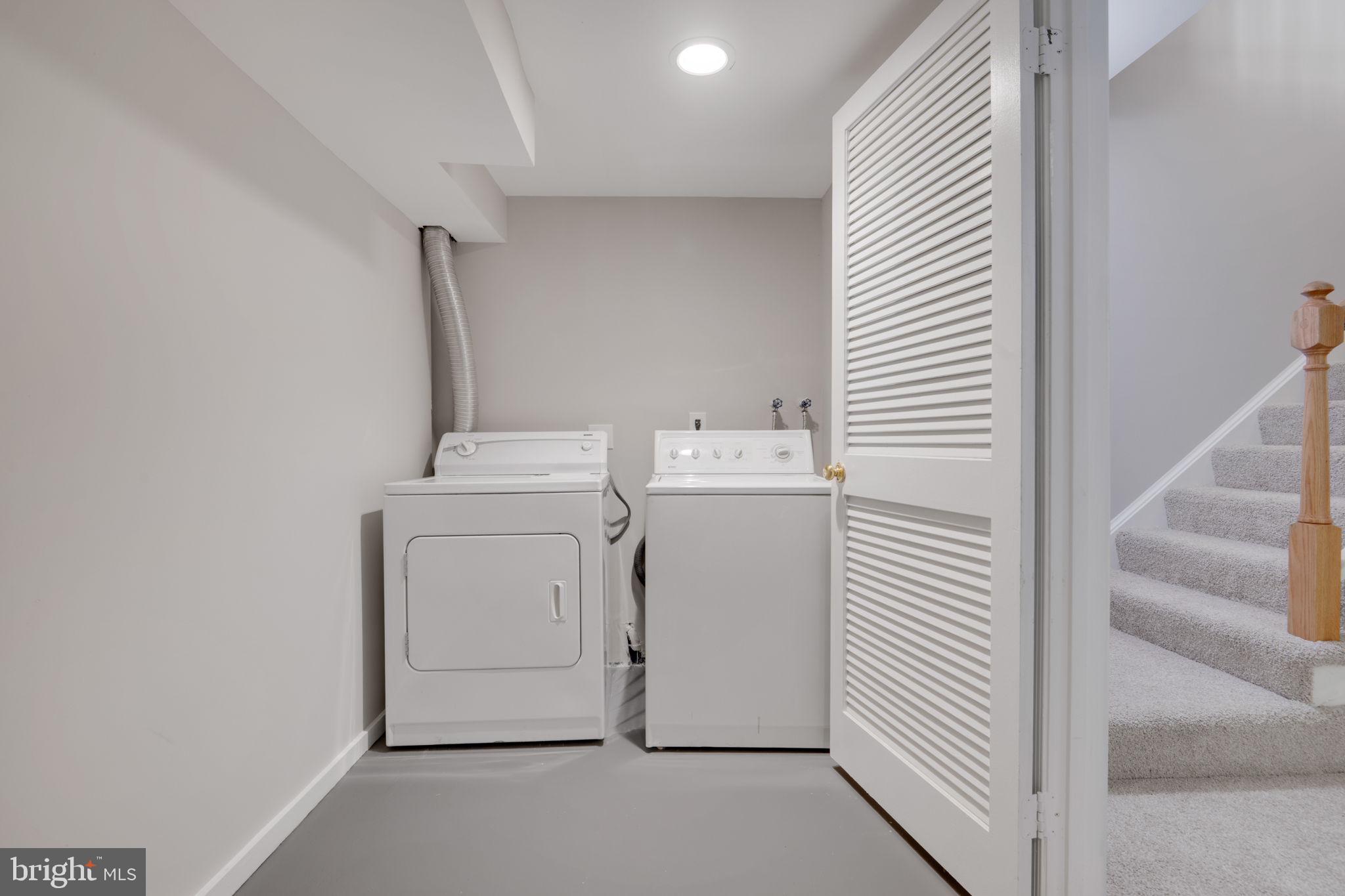 7267 Olde Lantern Way Springfield, VA 22152 - Photo 35 of 52 a utility room with dryer and washer