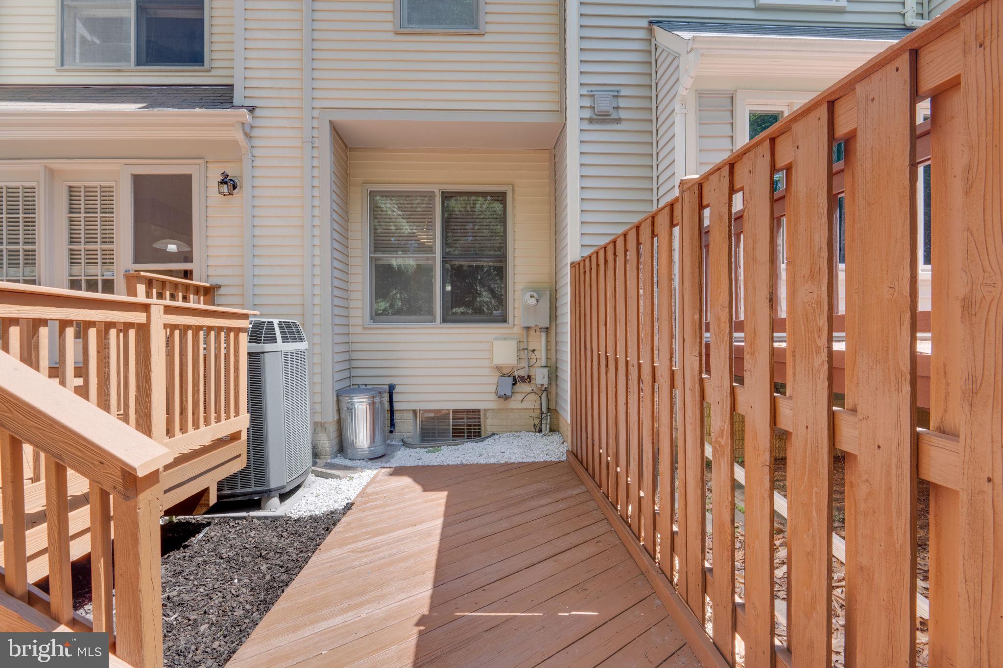 7267 Olde Lantern Way Springfield, VA 22152 - Photo 49 of 52 a view of a house with wooden floor and wooden fence