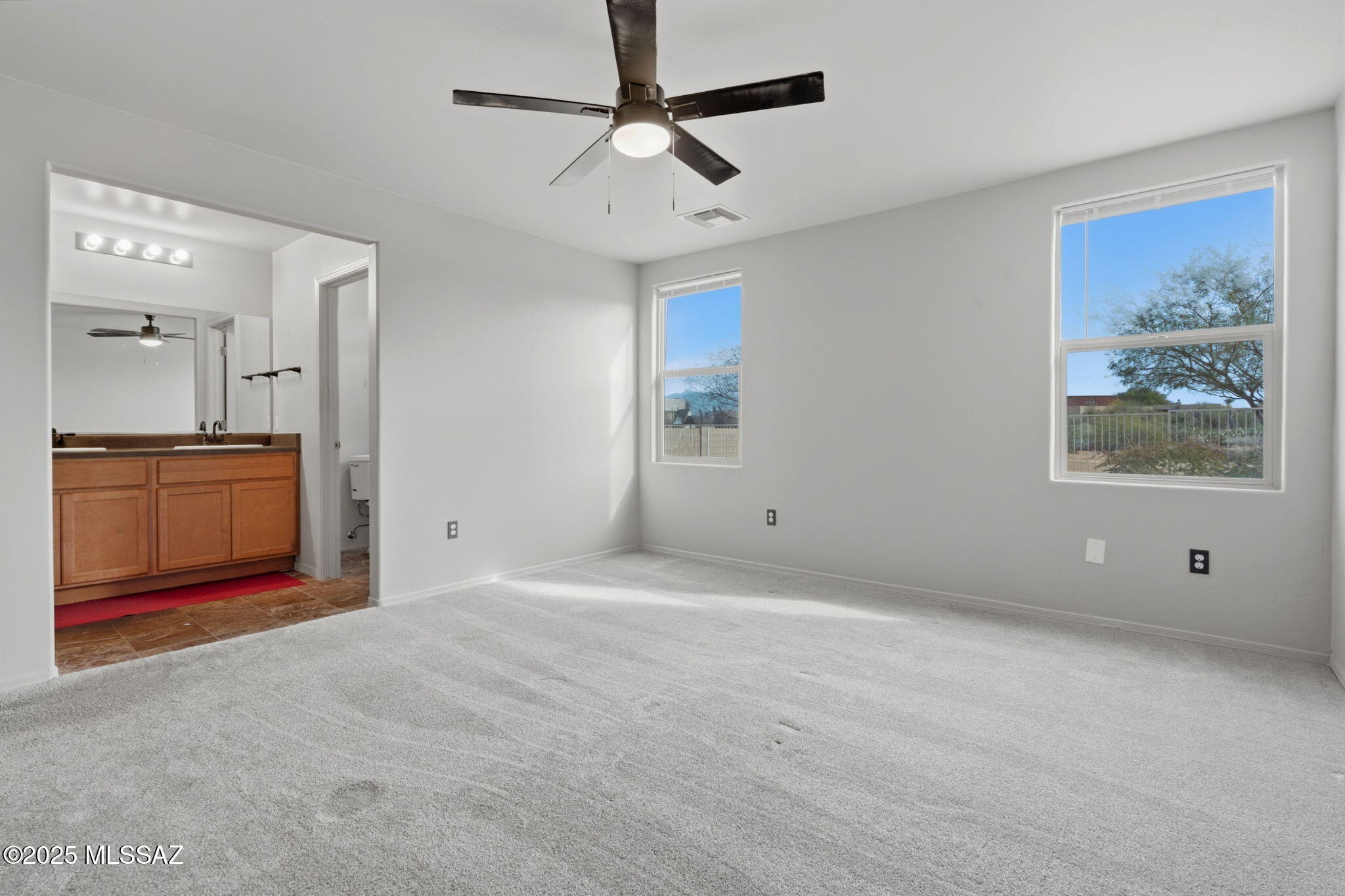 1458 North Wentworth Road Vail, AZ 85641 - Photo 19 of 44 a view of an empty room with a bathroom