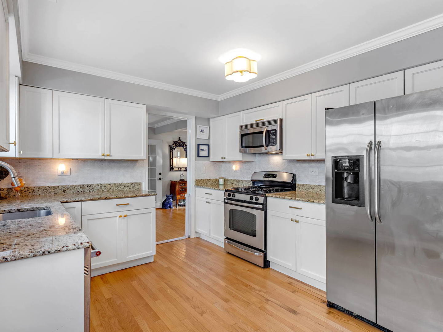 1251 Edgewood Road Lake Forest, IL 60045 - Photo 11 of 32 a kitchen with granite countertop stainless steel appliances and wooden cabinets