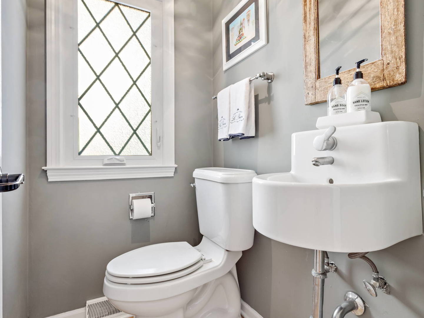 1251 Edgewood Road Lake Forest, IL 60045 - Photo 12 of 32 a white toilet sitting next to a bathroom sink