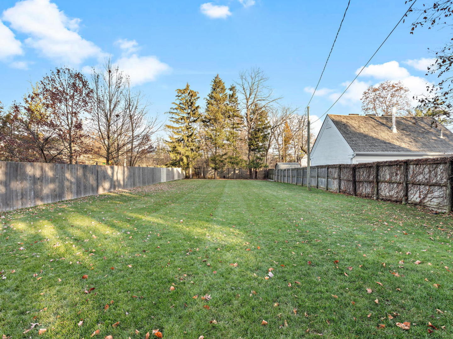 1251 Edgewood Road Lake Forest, IL 60045 - Photo 28 of 32 a view of a house with a yard and a tree