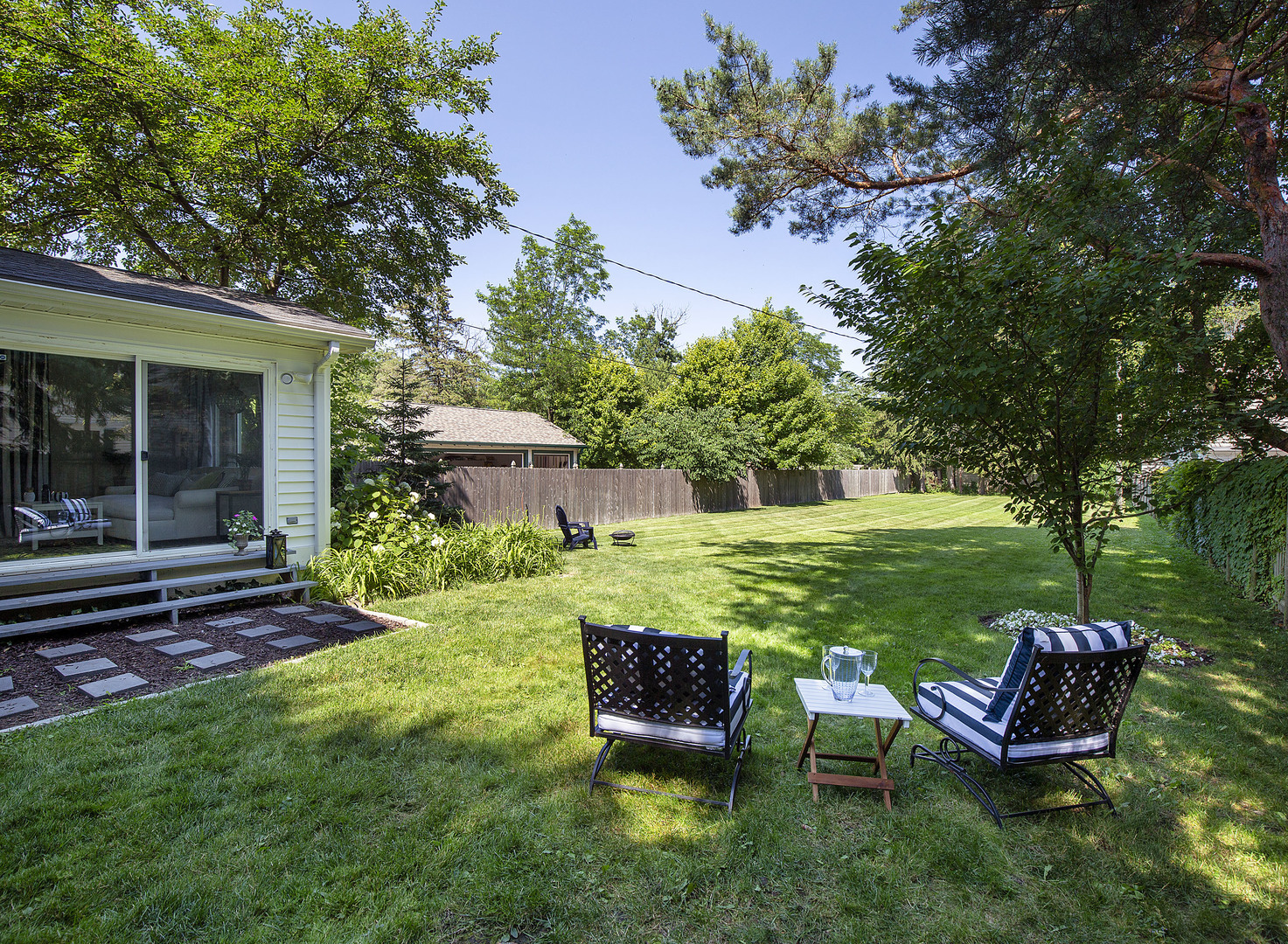 1251 Edgewood Road Lake Forest, IL 60045 - Photo 5 of 32 a view of a chair and table in the garden