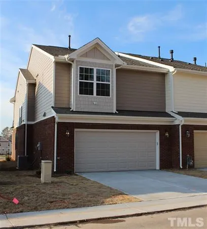 a front view of a house with garage