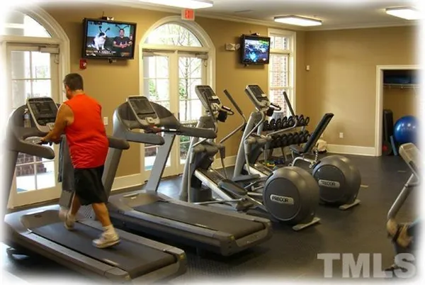 a view of a chairs and table in patio