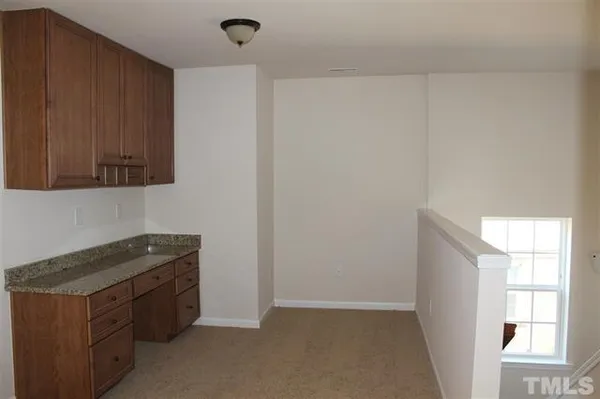 a kitchen with a stove and a cabinet