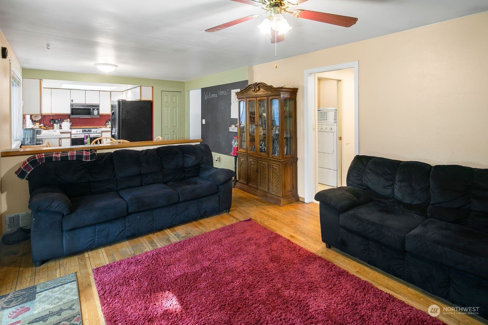 15612 119th Avenue Northeast Bothell, WA 98011 - Photo 14 of 32 a living room with furniture and a rug