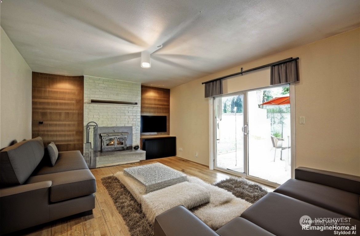 15612 119th Avenue Northeast Bothell, WA 98011 - Photo 15 of 32 a bedroom with furniture and a fireplace