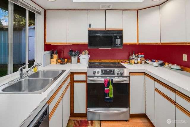 a kitchen with a stove and a sink