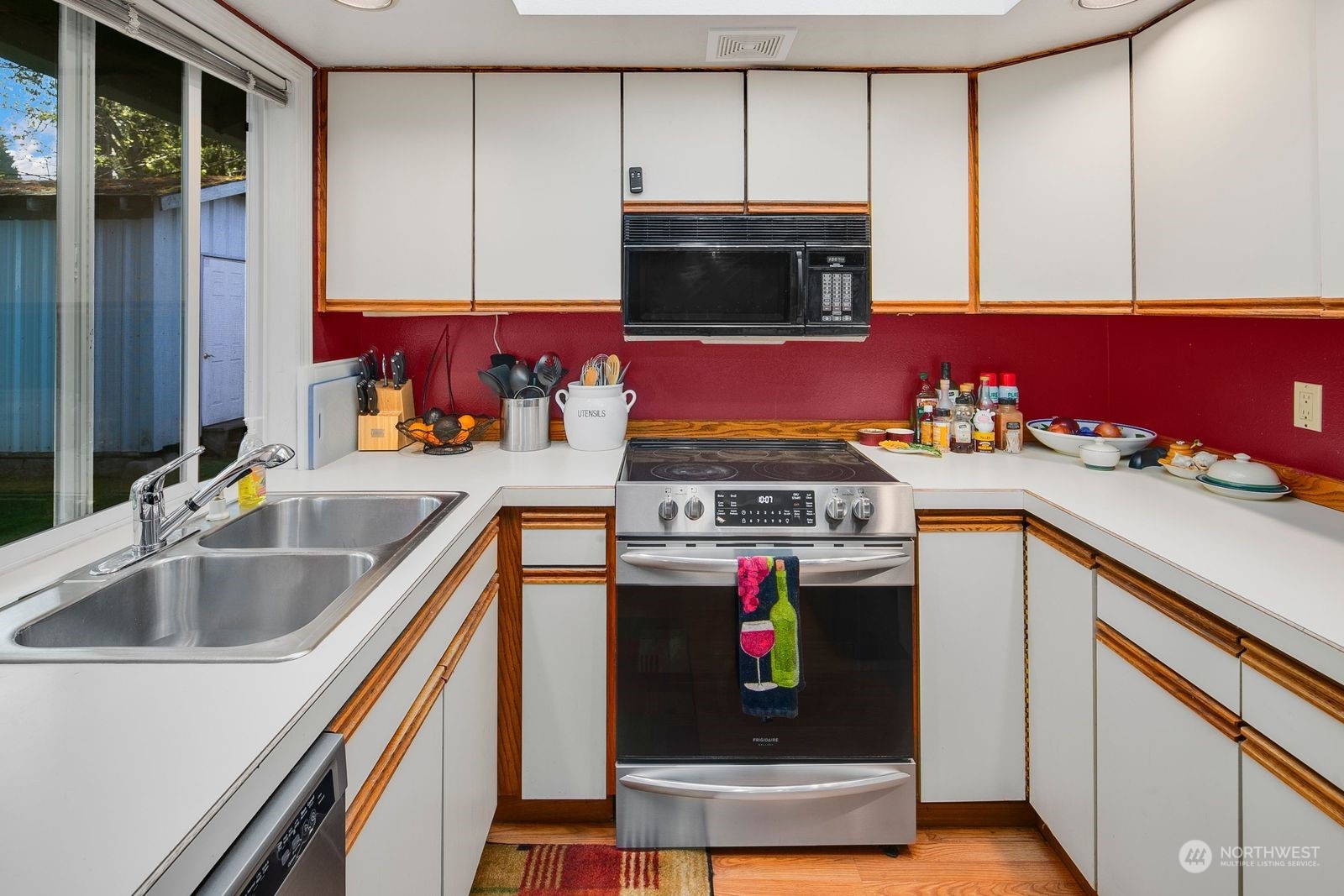 15612 119th Avenue Northeast Bothell, WA 98011 - Photo 16 of 32 a kitchen with a stove and a sink
