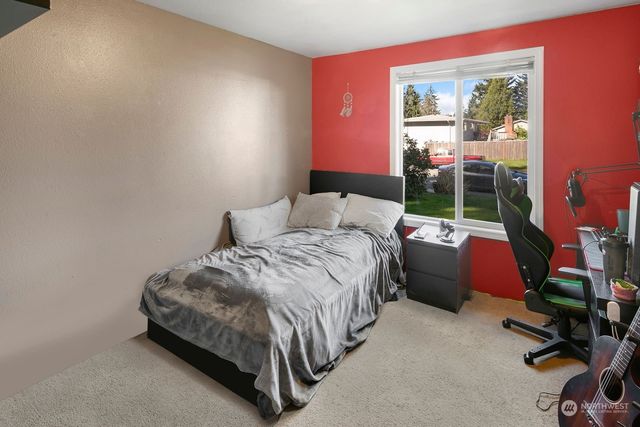 a bed room with a bed and a balcony